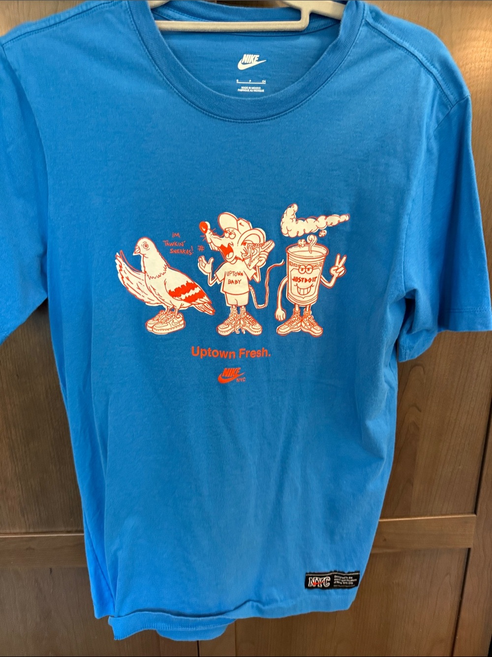 Nike Kids Blue 'Uptown Fresh' Graphic Tee with Orange Print